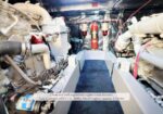 Clean engine room with twin Cummins 6BTA 5.9 diesel engines (~1700 hrs) and an organized layout.