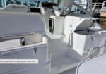 White boat deck showing a cleaning station and a refrigerated deep box; label reads 'Cleaning Station & refrigerated deep box.'