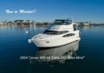 White motor yacht on calm blue water with overlaid text 'New to Market!!' and listing name '2004 Carver 466 Aft Cabin MY "Blue Mind"' indicating a boat for sale.