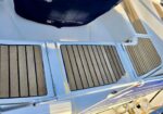Top-down view of a boat deck showing teak-style non-slip stepping panels