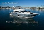 Promotional image of a luxury motor yacht named Freya in a marina, with a $60,000 price reduction caption.