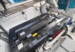 Volvo Penta marine diesel engine installed in a boat's engine room with hoses and control panels around it.