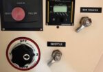 Boat control panel with Maxwell circuit breaker, ProLine gauge, bow thruster lever, inverter switch, and a large OFF rotary knob.