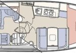 Top-down layout of a small motorboat: cockpit with helm, seating, mid-galley, dinette, and forward V-berth.