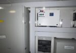 Power distribution cabinet with multiple circuit breakers in a utility/mechanical room acto as electrical switchgear area