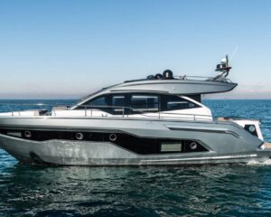 6661164_20180327055240183_1_XLARGE | Boat Universe Luxury motor yacht sailing on calm blue sea with a gray hull and white superstructure.