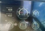 Dashboard panel shows engine hours: P 408 and S 402; center RPM gauge around 11×1000 rpm; right gauge indicates about 24–25V battery/alternator.