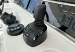 Boat throttle joystick on a white console; Yamaha logo on the base and surrounding mode buttons.