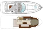 Top and lower deck diagram of a motorboat: exterior outline with cabin, seating, and helm visible in top view; interior layout below shows helm, galley, seating, and sleeping areas.